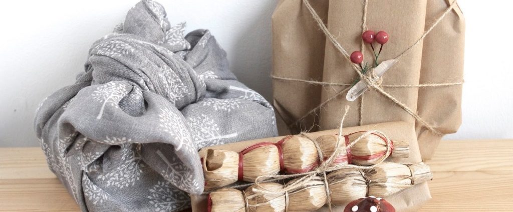 gifts wrapped with zero waste items such as a scarf and scrap paper