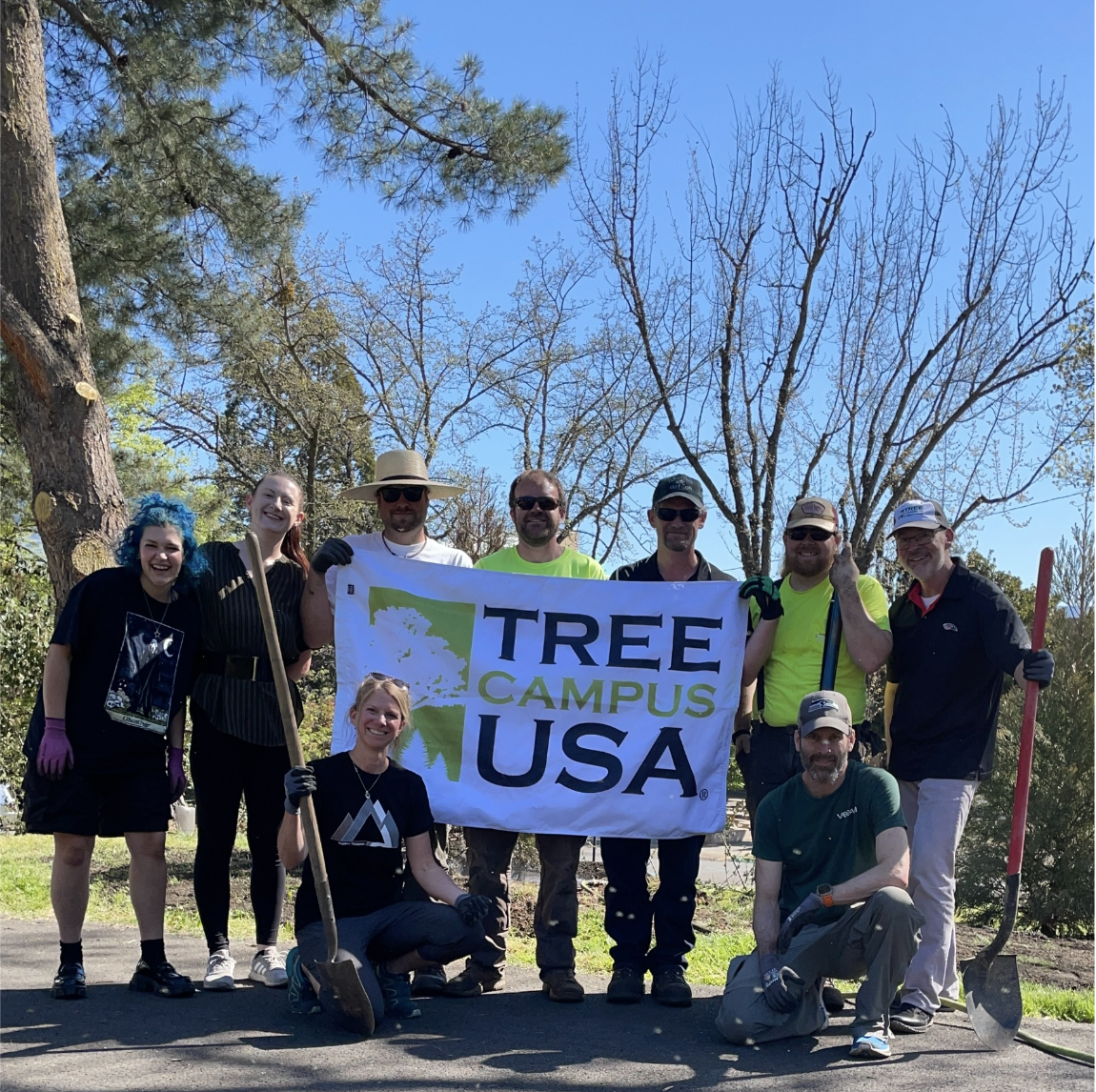 Arbor Day '22 with Tree Campus USA sign