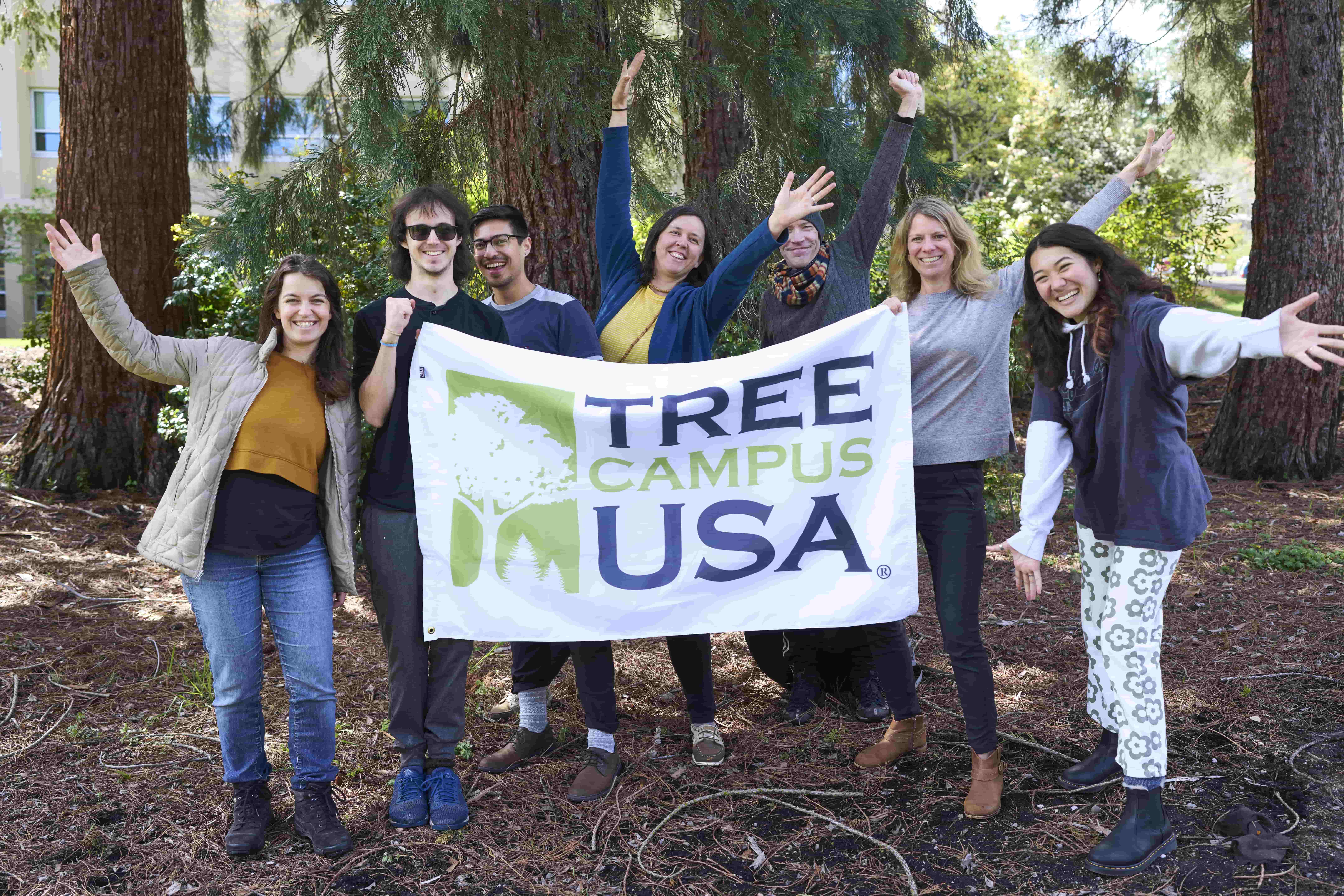 Students holding Tree Campus USA sign